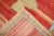 A Primitive early 20th-century Turkish Kars Village Rug with an open field design on a abrashed red ground dated 1906...