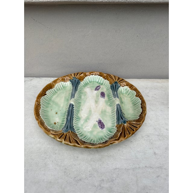 Unusual French Majolica asparagus plate with 3 spaces unsigned, circa 1890.