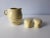 4 piece Russel Wright lot. Cramer & sugar combo Salt and pepper shakers Both chartreuse color.