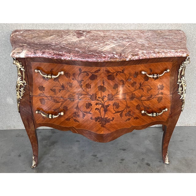French Louis XV style kingwood veneer commode, the shaped marble top above a bombe case with ormolu bronze mounts, highly...