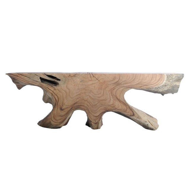 This striking console table is crafted from solid suar wood, a tropical hardwood known for its rich grain patterns and...