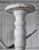 Pair of tall, vintage painted wooden columns. White painted finish is distressed in areas.