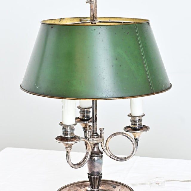 A lovely silver-plated French bouillotte lamp, this former candelabra was converted to electric for three candelabra-base...