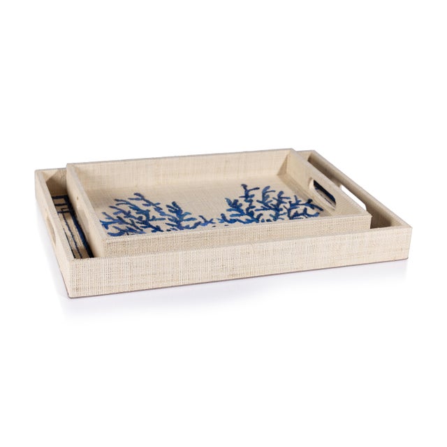 Inspired by oceanic beauty, this serving tray is made of chipboard wrapped in fine natural raffia fabric, showcasing a...