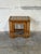 This set of three nesting tables features a space-saving design supported by turned spindle legs. The rectangular tops...