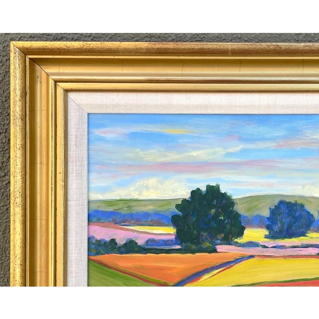 This is a wonderful oil on board impressionistic landscape of agricultural fields in a gold-colored frame. Signed on the...