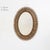 Description Oval-shaped wall mirror with perforated frame made of bamboo and rattan. The structure is composed of small...