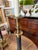 English Late 20th Century Classic Aged Brass and Black Candlestick Lamps With Paw Feet and Black Parchment Shades - Pair For Sale - Image 3 of 7