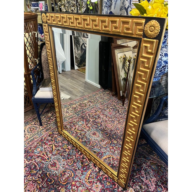 Oversized gold leaf Greek key mirror with beveled glass in a wooden frame. Beautiful gold and black detailing with corner...