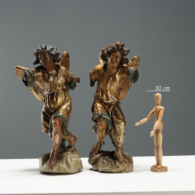 A pair of carved, lacquered, and gilded wooden angels. The strong emphasis on lacquer belies the artist's sculptural...