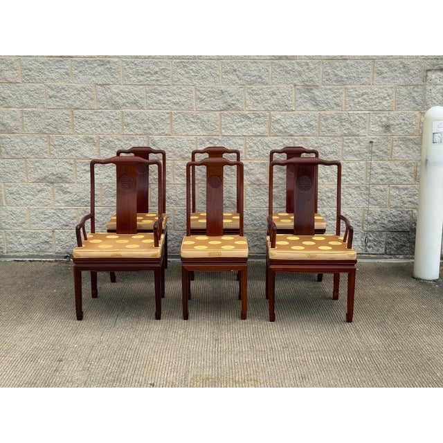 Likely rosewood or hongmu-style hardwood with a deep reddish brown finish and visible grain throughout. Includes two...