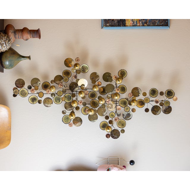 Large-scale vintage C. Jeré “Raindrops” wall sculpture featuring a striking composition of brass and copper discs in...