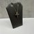 This striking black diamond cross necklace in 14kt yellow gold features 0.86 carats total weight of round black diamonds,...