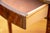 A Federal-style mahogany Pembroke drop-leaf table of quiet authority — satinwood inlaid square tapered legs, single drawer...