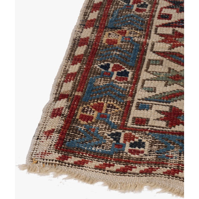 Lightly distressed with low pile that adds to the patina and beauty of this hand woven rug. The rug has a solid foundation...