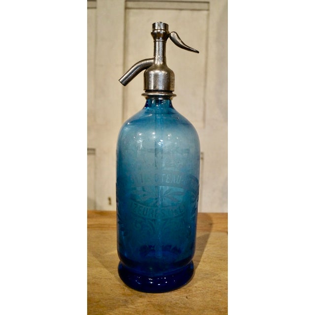 Set of three early 20th Century French soda syphons. All three are of great shapes and rich colours, all etched with the...