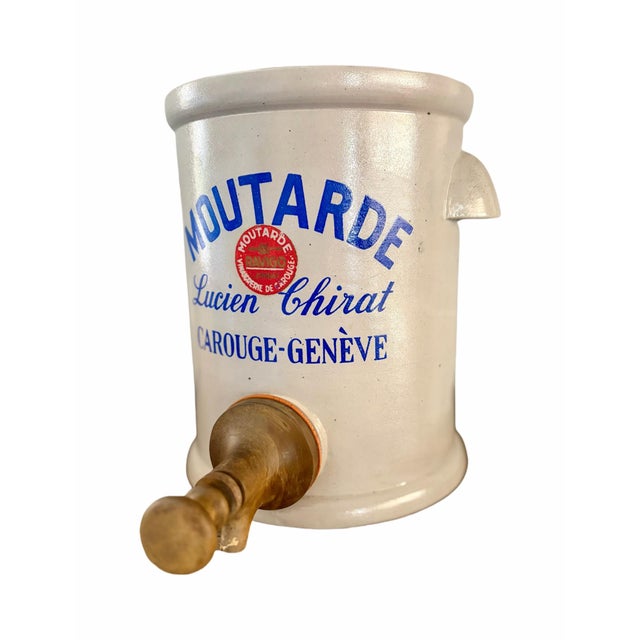A striking blend of European utility and understated elegance, this vintage mustard dispenser crock by Lucien Chirat of...