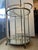 Two Tiers with a glass top shelf and a lower mirrored shelf Integrated hanging stemware racks for wine glasses under the...