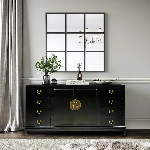 With its smooth and lustrous black lacquer finish, this sideboard adds a sleek and contemporary style with an eastern...