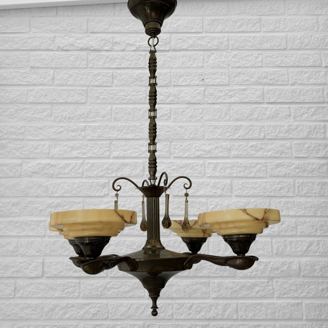 A decorative Scandinavian four-arm chandelier produced in Sweden during the 1930s by the renowned manufacturer Bröderna...