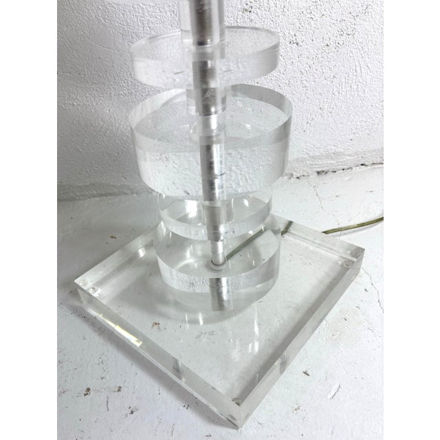 This is a mid-century vintage stacked lucite floor lamp by the designer Karl Springer. This stacked lucite floor lamp has...