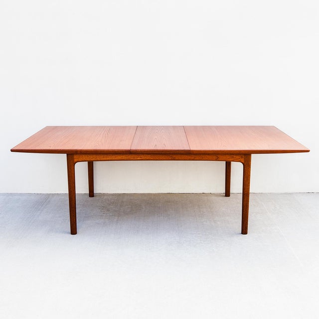 A large Scandinavian mid century dining table with two leaf extensions by Folke Ohlsson, made in Sweden by DUX in the...