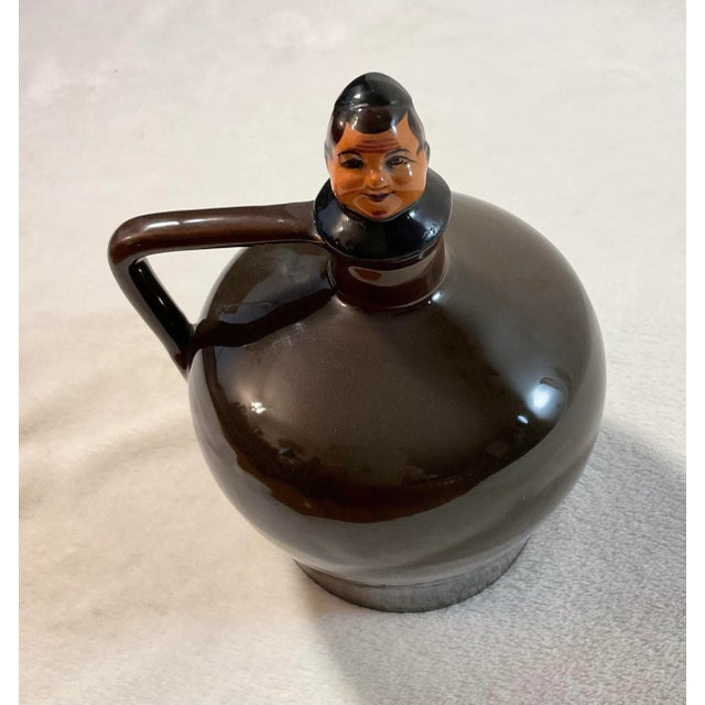 Unique old liquor decanter plus a music box. When wound it plays a tune, "How Dry I Am" by Irving Berlin. Plays when you...