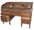 Early 20th century office desk made of quarter sawn oak. A tambour roll top door covers the work area. Six large drawers...