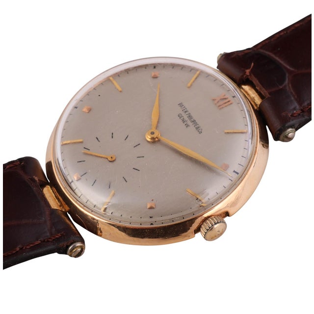Vintage Patek Philippe Geneve Calavatra manual-wind wristwatch in 18K yellow gold featuring a 35mm round case with...