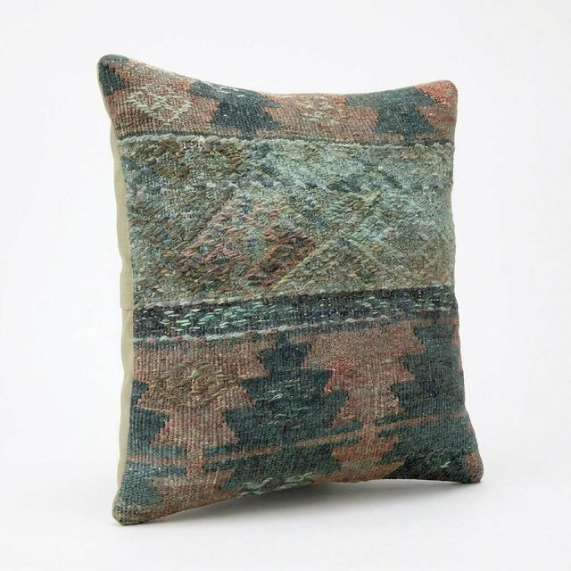 This beautiful 16'' x 16'' Turkish Kilim pillow cover was made from authentic handwoven flatweave kilim. The traditional...