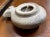 This is what is believed to be either an ancient or replica antique Terracotta oil lamp from the Herodian or Roman period,...