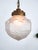 Early 1900’s brass and etched glass globe pendant from The Netherlands. Suspended from a tiered brass gallery is a good...