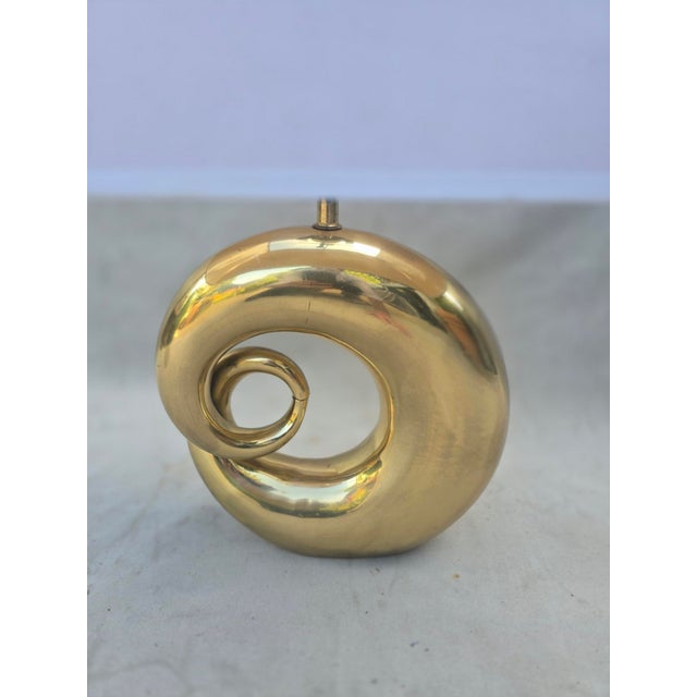 This is an extremely heavy solid brass lamp in swirl shape. This style is frequently attributed to Pierre Cardin. It...