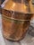 A substantial antique English copper milk churn embossed “United Dairies Wholesale Ltd.” and marked with the number “10.”...