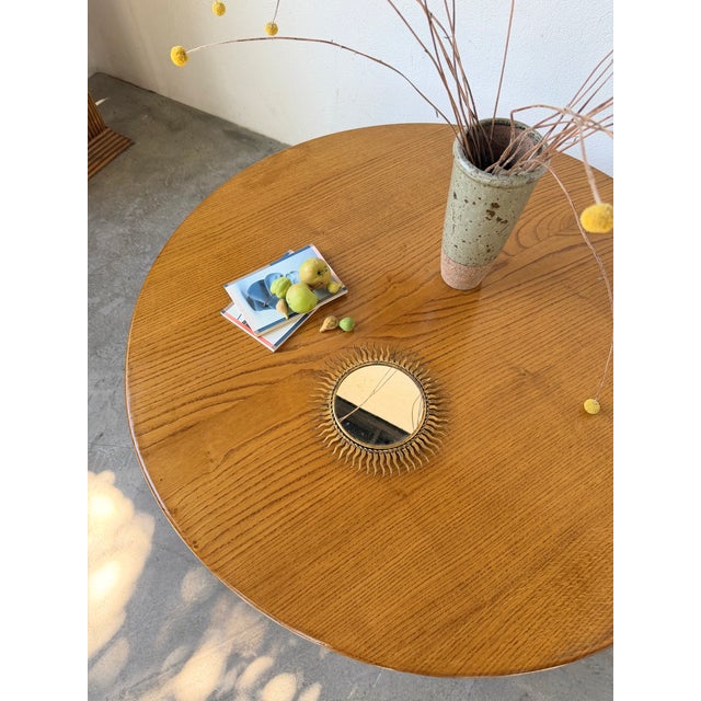 Small sunburst mirror in patinated gold metal, XS size. Beautifully undulating sunburst arms. Hanging attachment on the...