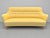 The sofa, in good condition, was reupholstered in yellow cotton fabric, replacing the original. This piece is attributed...