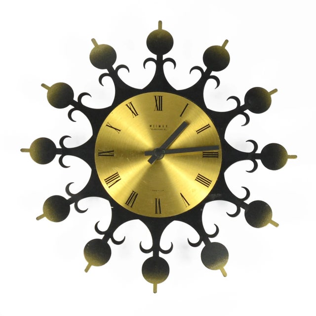 Wall clock of the sun type, manufactured by the German company Weimar at the turn of the 1960s and 1970s. An object with a...