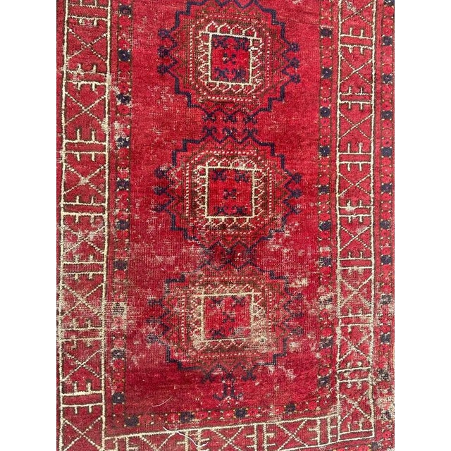 Beautiful antique tribal Turkmen rug with a geometrical design and nice natural colours with red, brown, blue and white,...