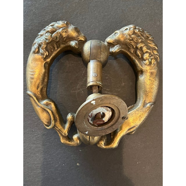 Large 19th century antique brass door knocker featuring 2 full bodied lions It is very well cast. The lions tails are on...