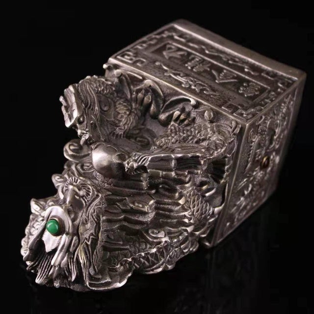 This striking piece is a magnificent representation of a traditional Chinese imperial seal. It features a heavily...