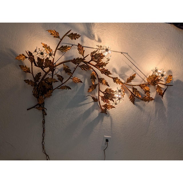 An exceptional Italian gilt-iron wall lamp, crafted with a level of detail and material quality rarely seen today. The...