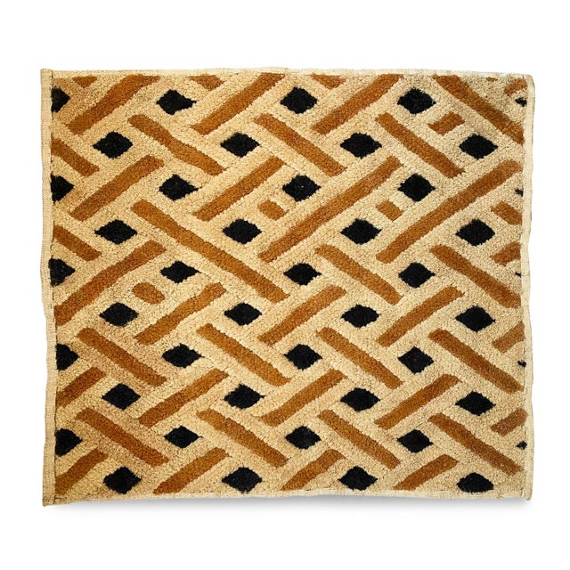 Traditional vintage Kuba grass textile handmade from the indigenous people of the Congo. Bold geometric patterns created...