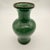 This item is a Chinese-style porcelain vase featuring a vibrant apple-green crackle glaze. Vases of this design feature an...