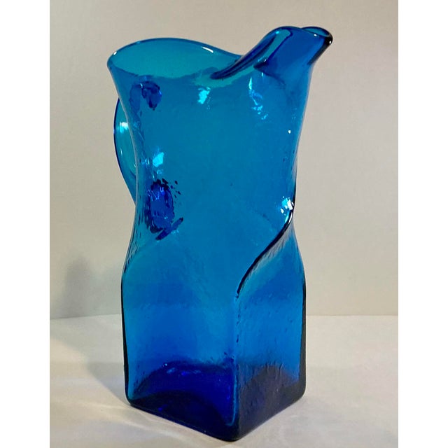 A striking vintage Morgantown Glass Swirl Pitcher Pattern number 9844 in brilliant blue Art glass. At an impressive 11...