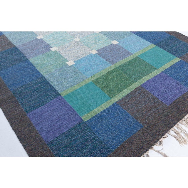 Mid-20th Century Swedish flat woven rug by Ulla Pakdal Size: 5'3" × 7'9" (160 × 236 cm) This captivating vintage flat-...