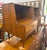 This vintage mid-century modern nightstand with a lower open compartment and a single integrated drawer, designed by...