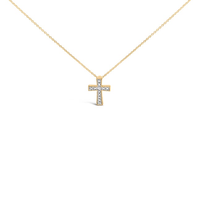 A whisper of devotion and glow, this petite cross pendant brings quiet radiance to everyday moments. Its silhouette is...