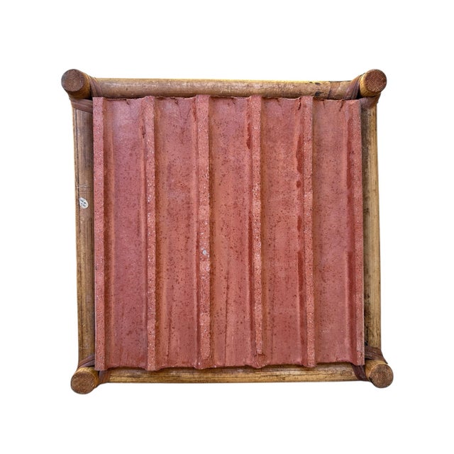This charming vintage rattan side table features an authentic stamped Impruneta terracotta tile top, bringing a warm...