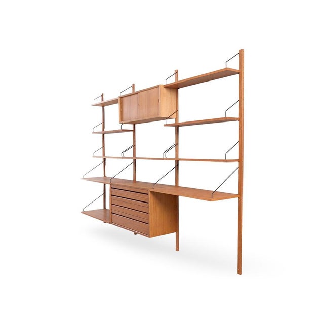 We are offering a beautiful, large wall shelf from the traditional Danish manufacturer Cado, dating from the 1960s, for...