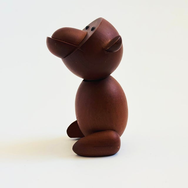 A mid century turned wood figurine in the shape of a monkey. Adorable stylized features. Made in Japan by Senshukai as...